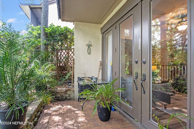 view of exterior entry featuring french doors