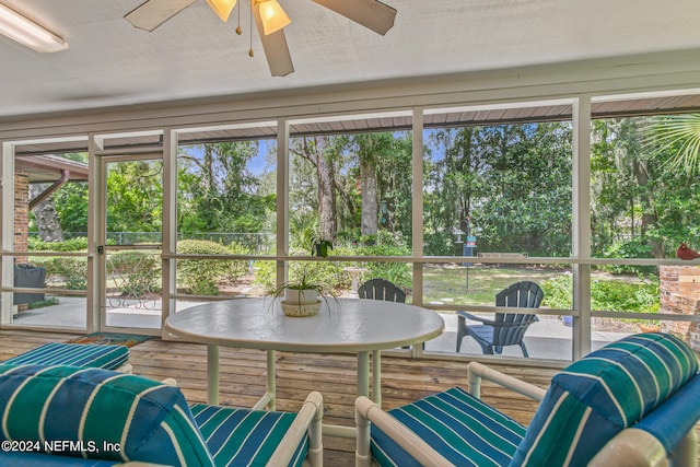 sunroom featuring a wealth of natural light and ceiling fan