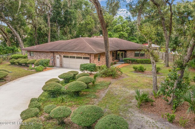 single story home with a garage