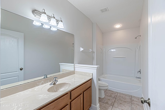 full bathroom with vanity, toilet, tile patterned floors, and washtub / shower combination