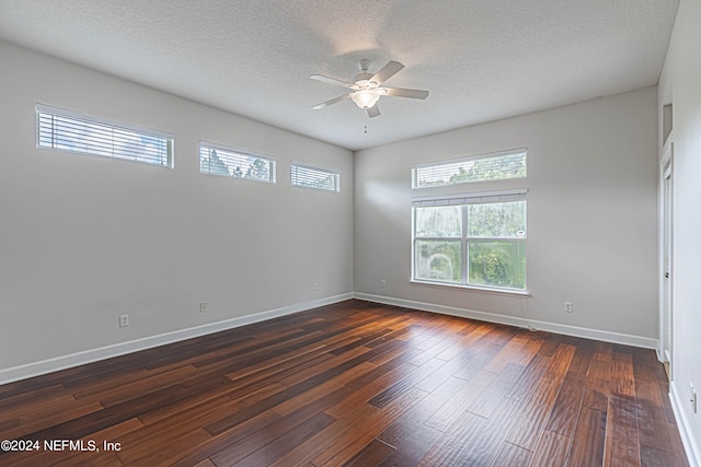 unfurnished room with dark wood-type flooring, a textured ceiling, and ceiling fan