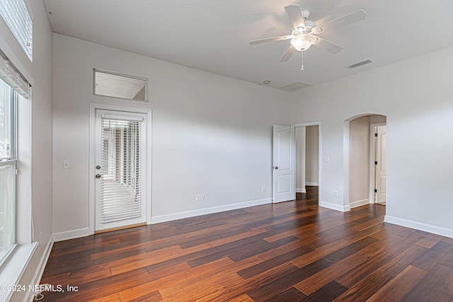 unfurnished room featuring ceiling fan and dark hardwood / wood-style floors