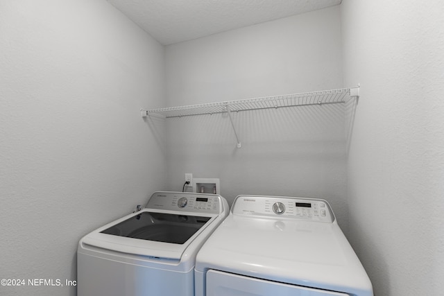 clothes washing area featuring washing machine and dryer