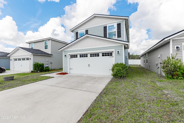 view of front facade featuring a garage and a front yard