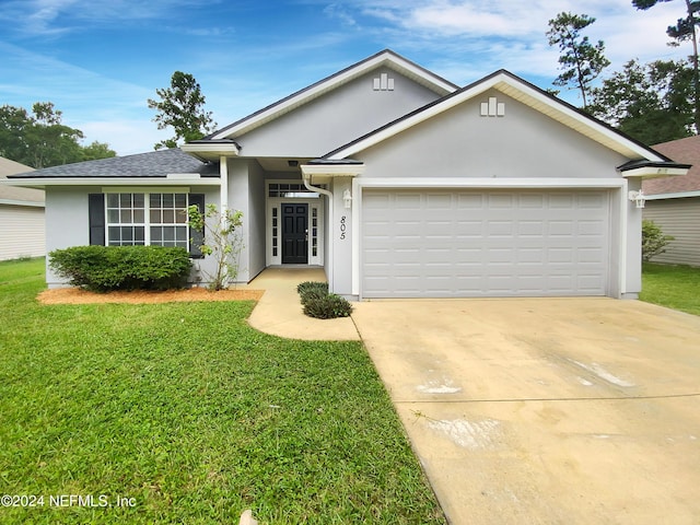 ranch-style house with a garage, a front yard, concrete driveway, and stucco siding