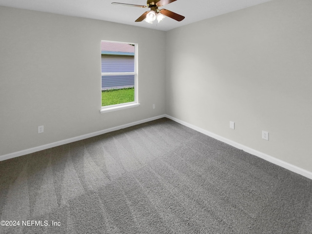 spare room with ceiling fan and carpet flooring