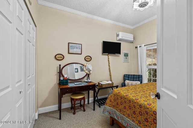 carpeted bedroom with baseboards, a wall mounted AC, a closet, a textured ceiling, and crown molding