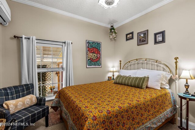 carpeted bedroom with ornamental molding, a textured ceiling, and a wall mounted air conditioner