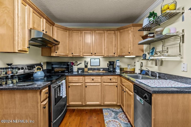 kitchen with under cabinet range hood, a sink, a textured ceiling, dark wood-style floors, and stainless steel appliances