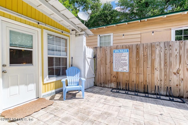 view of patio / terrace featuring fence