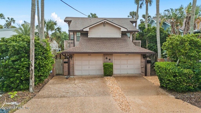 view of front of home featuring a balcony and a garage