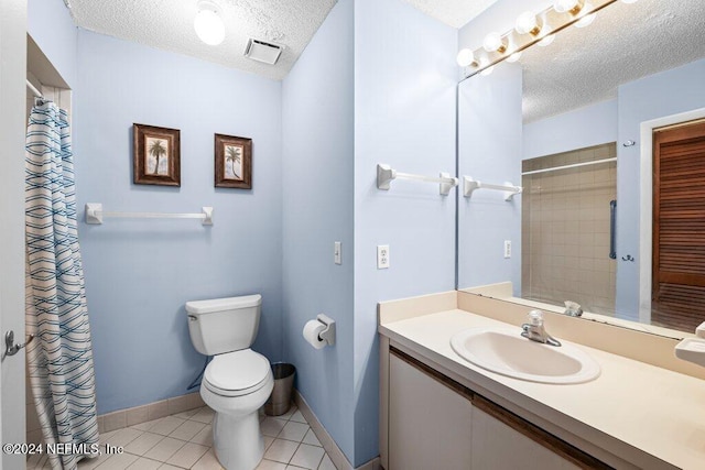 bathroom featuring toilet, a shower with curtain, a textured ceiling, vanity, and tile patterned flooring