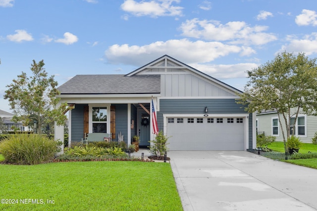 view of front of house featuring a garage and a front lawn