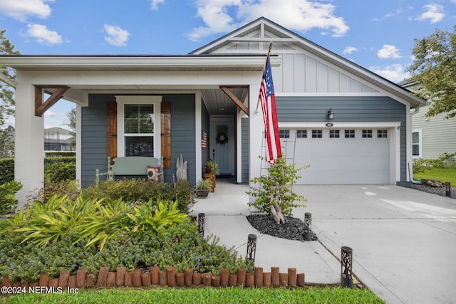 view of front of property featuring a garage and covered porch