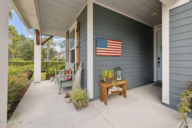 view of patio featuring a porch