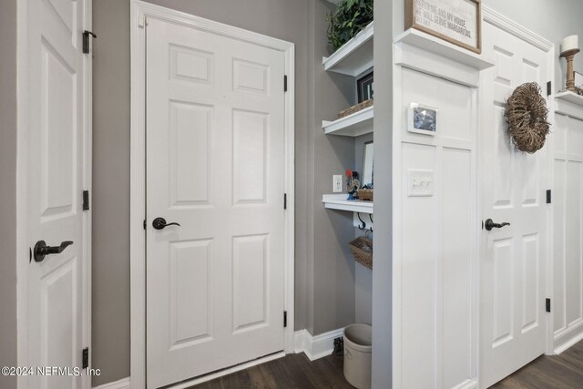 mudroom with dark hardwood / wood-style floors