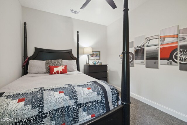 carpeted bedroom featuring lofted ceiling and ceiling fan