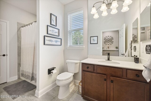 bathroom featuring vanity, toilet, and a shower with curtain