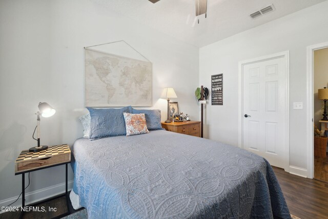 bedroom featuring dark wood-type flooring and ceiling fan