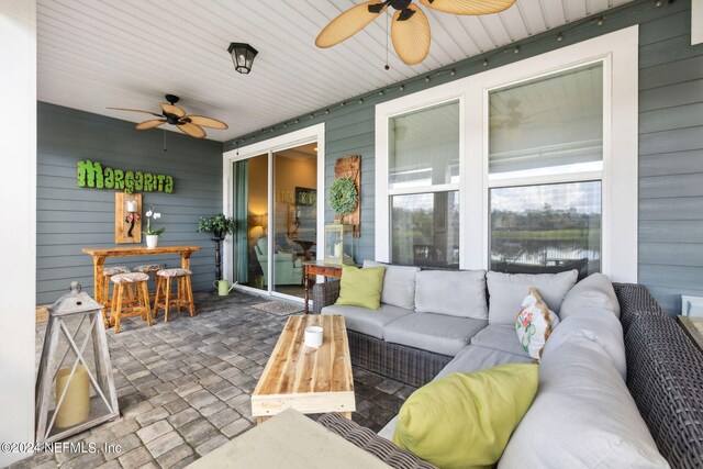 view of patio featuring ceiling fan and an outdoor hangout area