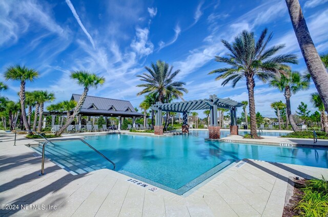 view of pool featuring a patio area and a pergola