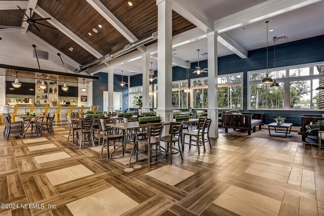 dining area featuring a wealth of natural light, ceiling fan, and high vaulted ceiling