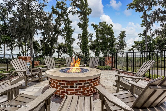 deck featuring a patio area and an outdoor fire pit