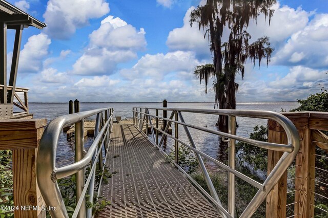 dock area with a water view