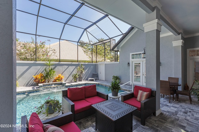 view of patio featuring glass enclosure and outdoor lounge area