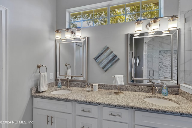 bathroom with an enclosed shower and vanity