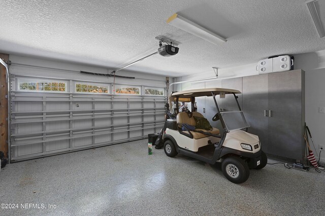 garage featuring a garage door opener