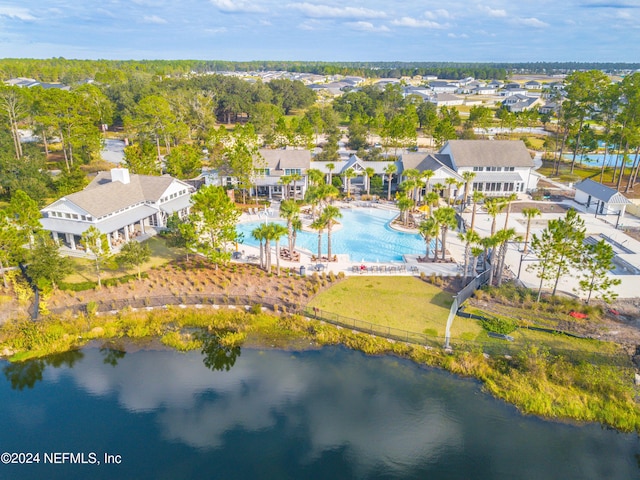 drone / aerial view featuring a residential view and a water view