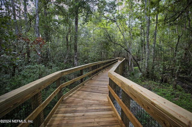 view of community featuring a wooded view