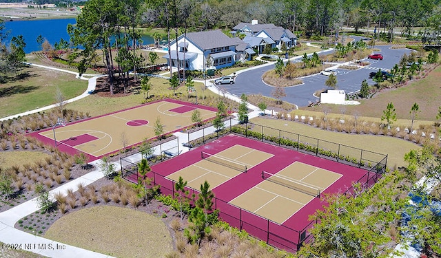 birds eye view of property with a water view