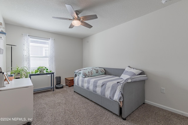 bedroom featuring a textured ceiling, ceiling fan, carpet flooring, and baseboards