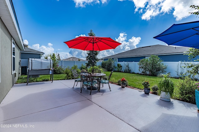 view of patio / terrace with a fenced backyard and outdoor dining area