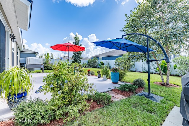 view of yard featuring a patio and fence