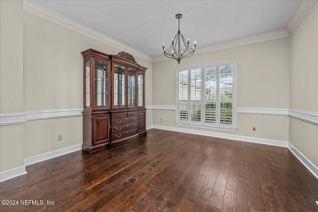 unfurnished dining area featuring a chandelier, ornamental molding, dark wood-style flooring, and baseboards