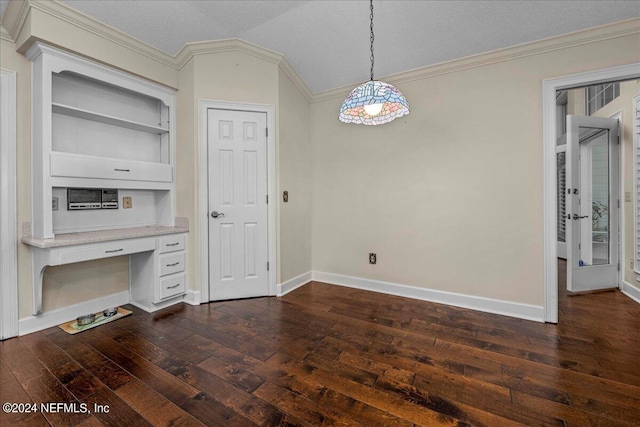 interior space with dark wood-style floors, vaulted ceiling, built in study area, and ornamental molding