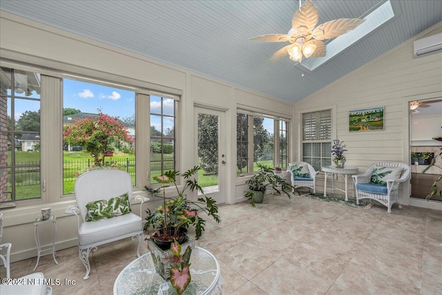 sunroom with ceiling fan, vaulted ceiling, and a wall unit AC