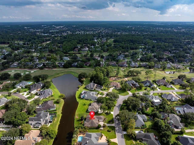 birds eye view of property featuring a residential view and a water view