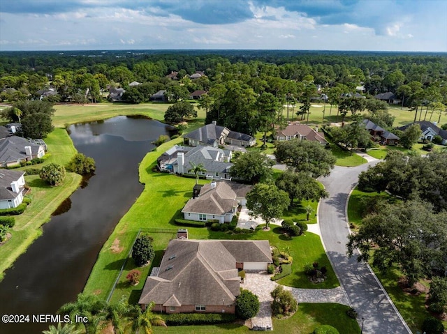 aerial view featuring a water view and a view of trees