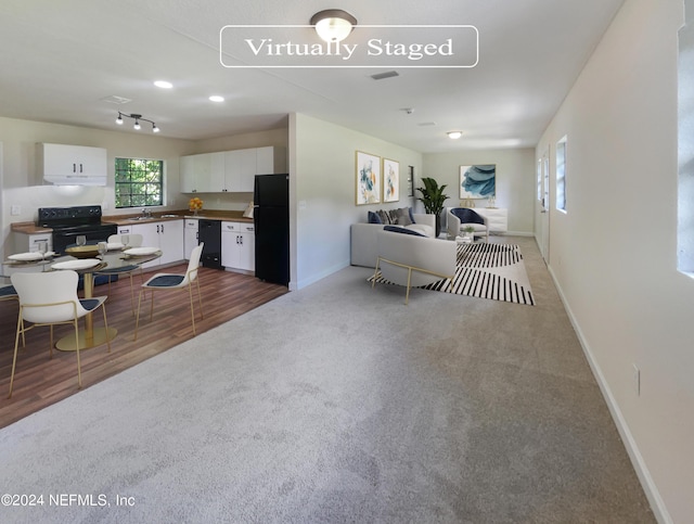 interior space with carpet floors, visible vents, and baseboards