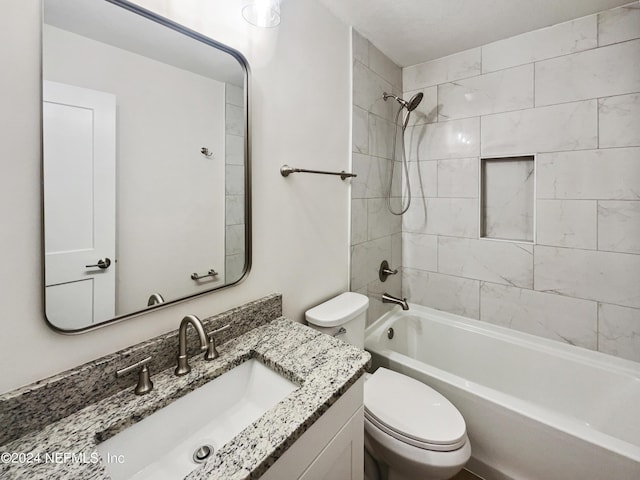 full bath with shower / bathtub combination, vanity, and toilet