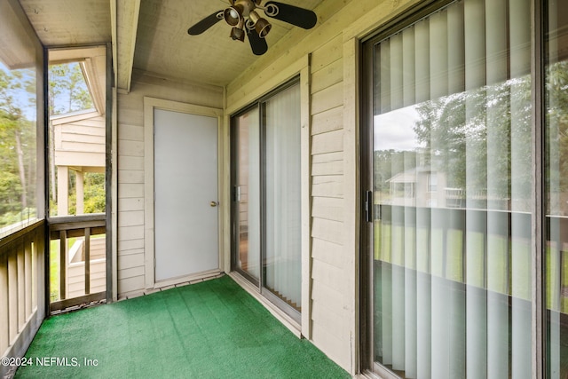 unfurnished sunroom featuring plenty of natural light and ceiling fan