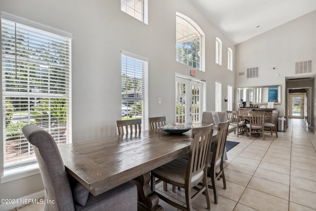 dining area with light tile patterned floors, french doors, visible vents, and a healthy amount of sunlight