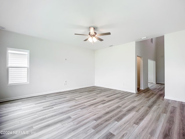 spare room with ceiling fan and light hardwood / wood-style floors