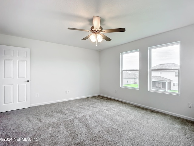 unfurnished room featuring carpet and ceiling fan