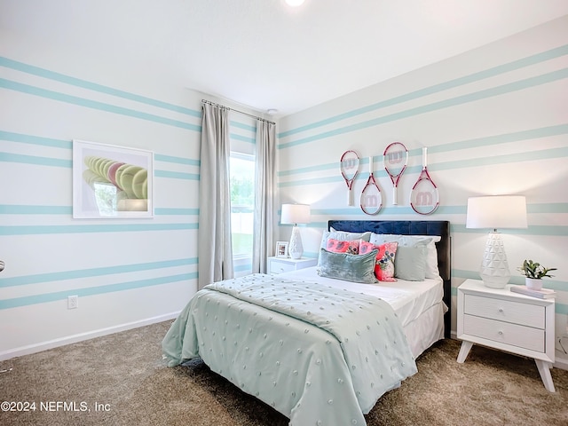 bedroom featuring baseboards, carpet, and wallpapered walls