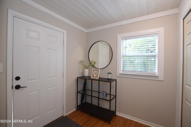 entryway with wood-type flooring and ornamental molding